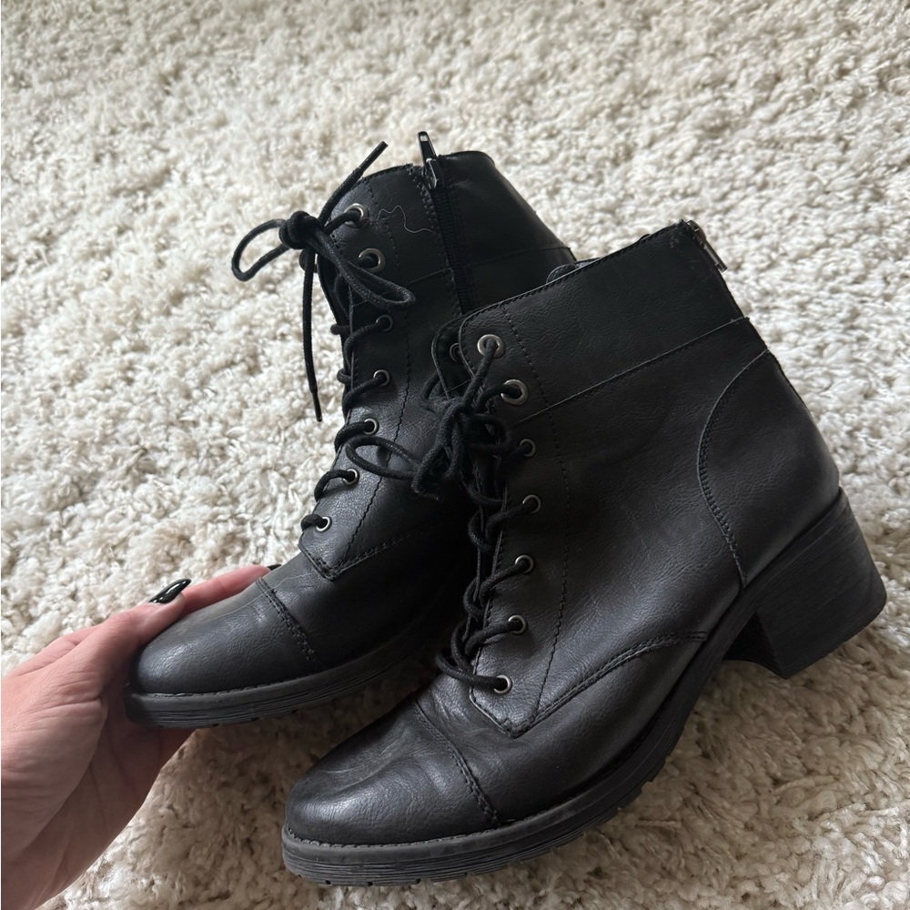 Black leather ankle boots with a grunge emo street combat vibe